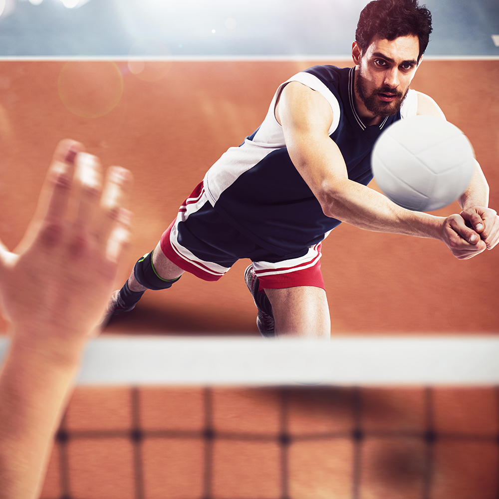 Volleyball player receives the ball from another player